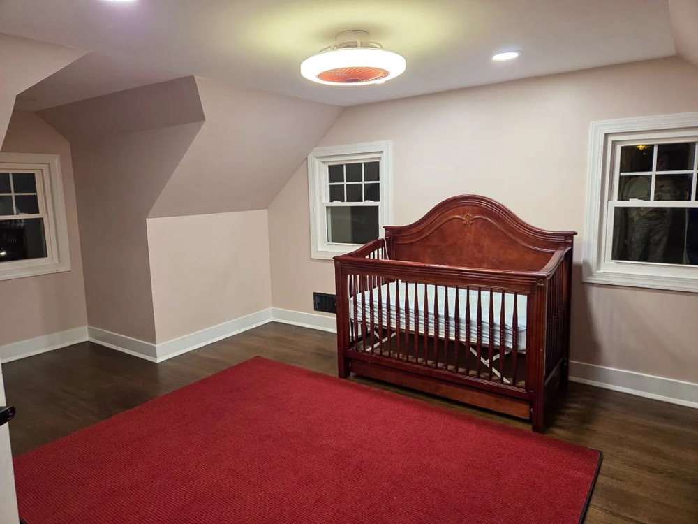 Finished attic bedroom renovation with new hardwood floors